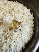 Load image into Gallery viewer, Rose Cut Citrine Ring with a Trio of Cubic Zirconia set in Silver accent Bubbles. Ring Sitting in a bed of white rice.
