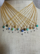 Load image into Gallery viewer, Enamel Evil Eye Necklaces on 14k Gold Fill Chains with labeled color options, shown on a linen mannequin
