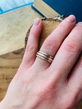 Load image into Gallery viewer, A trio of Stackable Rings: 14k Gold Fill Twinkle Band, Sterling Silver Facets Band and 14k Gold Fill Country Roads Band
