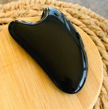 Load image into Gallery viewer, Black onyx Gua Sha Massage Stones on a brown woven basket
