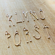 Load image into Gallery viewer, Hammered Gold Fill Lovely Letter initial Charms K through T on a rustic wood background.
