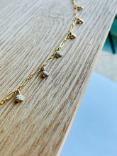 Load image into Gallery viewer, 14k Gold Fill Misty Morning Necklace with tiny dangling Cubic Zirconia Droplets on a piece of natural wood.
