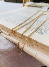 Load image into Gallery viewer, 14k Gold Fill Rope Chains on a vintage dictionary page. 
