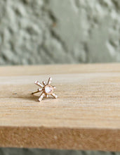 Load image into Gallery viewer, Single 14k Gold Fill Star Crossed Lover Stud Earrings on a simple wooden board. 
