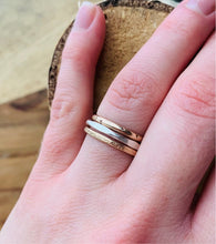 Load image into Gallery viewer, Trio of Stacking Rings: Hand Carved Twinkle Band in 14k Gold Fill, Facets Band in Sterling Silver and Country Roads Band in 14k Gold Fill
