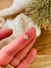 Load image into Gallery viewer, Reverse Set CZ Little Gemmy Bit Necklace shown on artists hand for scale. 
